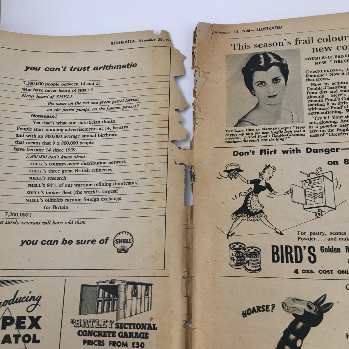 Interior view of the VTG Illustrated Magazine from November 20, 1948, titled 'Man and Superman', displaying pages with advertisements, showing signs of age and tear.