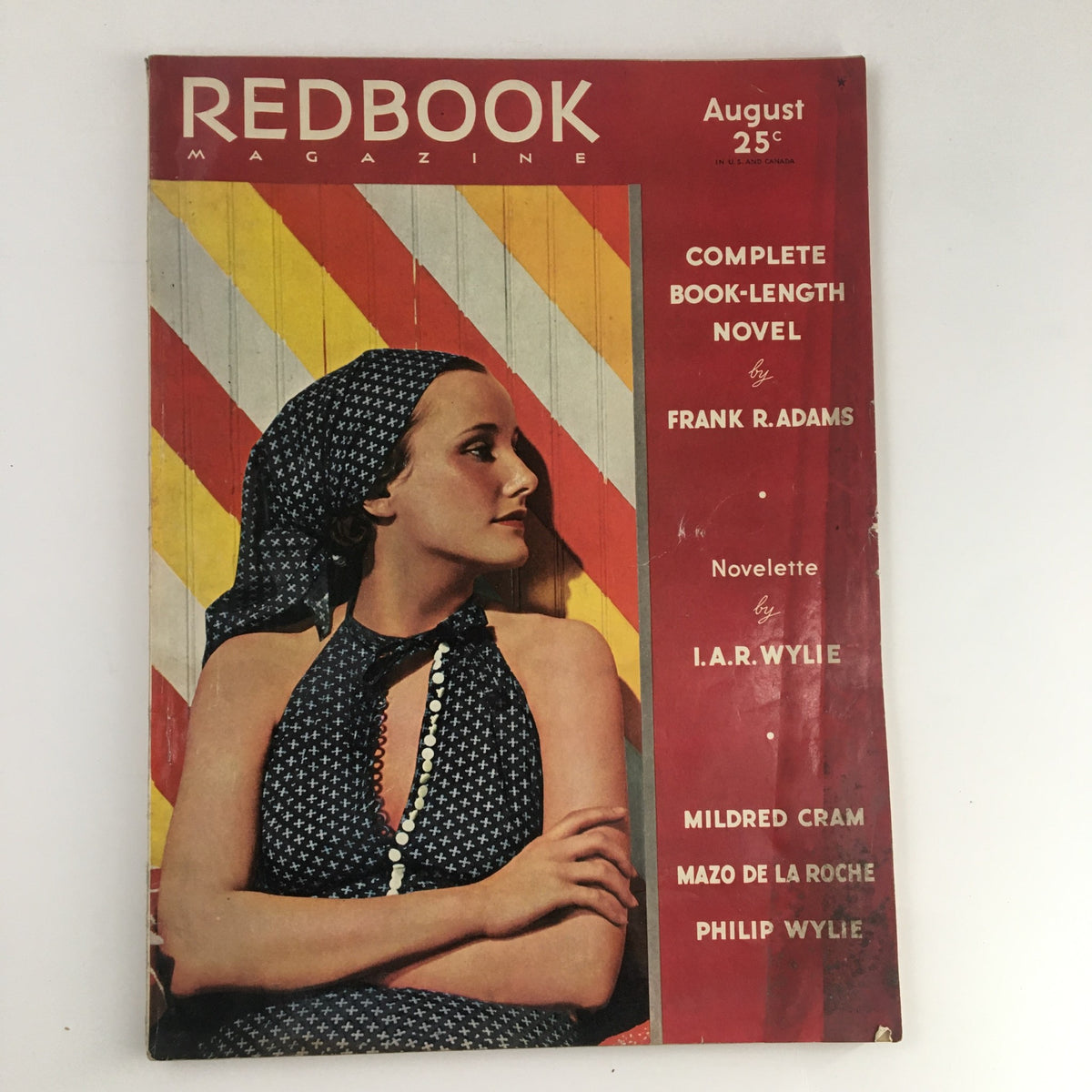 Cover of VTG Redbook Magazine August 1936 featuring a woman portrait and colorful geometric background, exploring the theme 'Should a Wife Surrender to Any Rival?'.