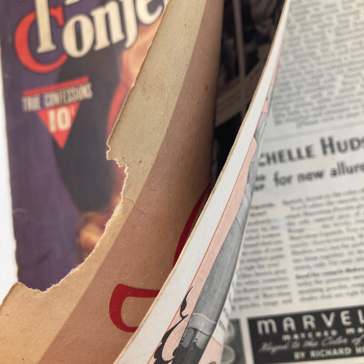 Inner view of the Vintage True Confessions Magazine from November 1939, showing page damage and the magazine's title for context.