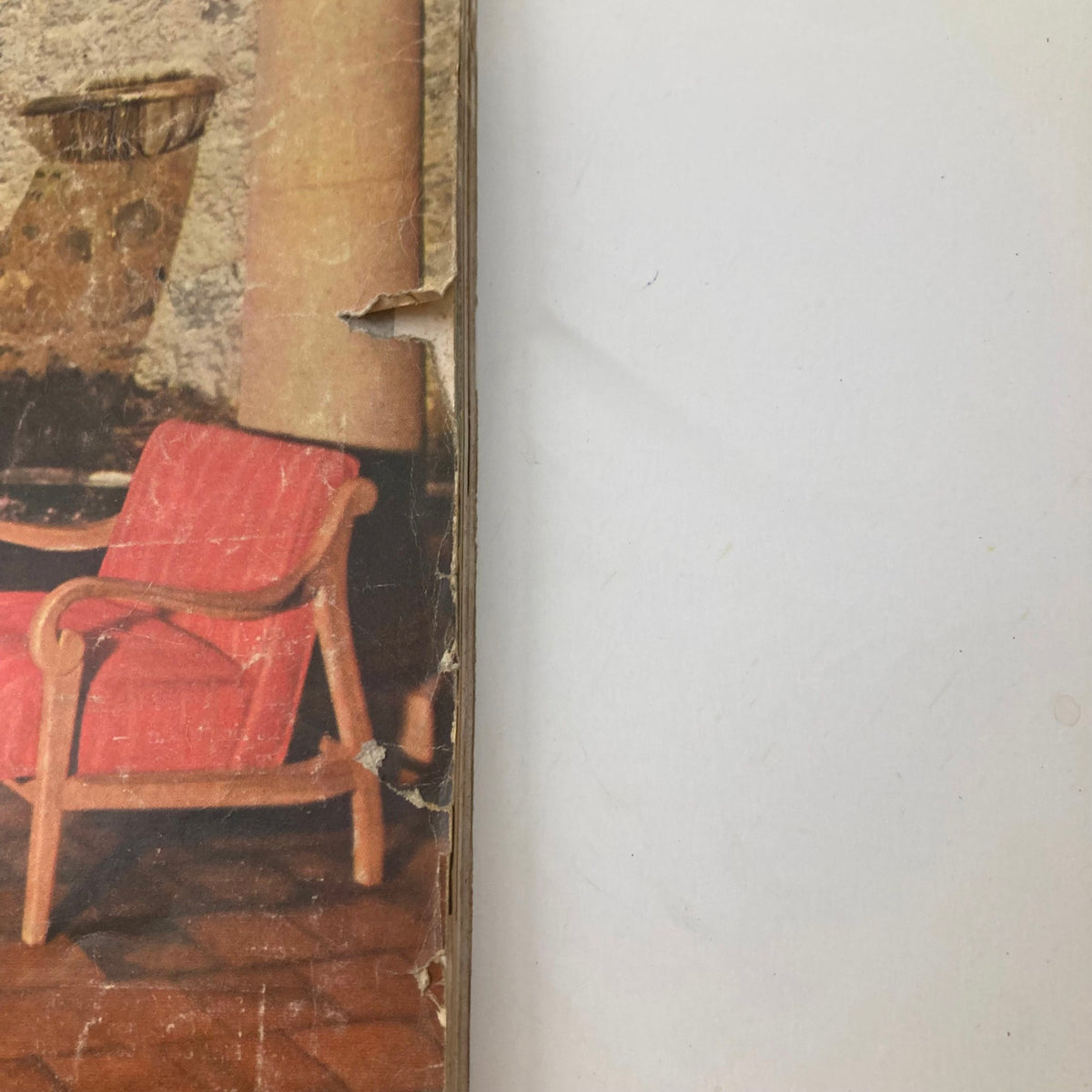 Side view of the House Beautiful Magazine September 1957, showcasing the spine with a partially visible cover, emphasizing its vintage condition and aesthetic appeal.