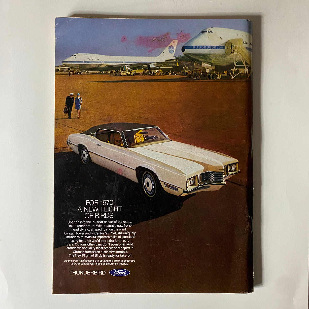 Advertisement page from The New Yorker magazine dated November 22, 1969, showcasing a Ford Thunderbird car amid a backdrop of planes at an airport.