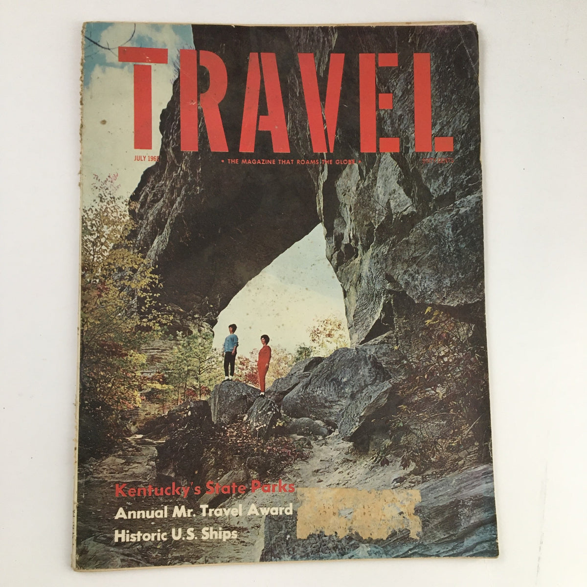 Cover of VTG Travel Magazine July 1965 featuring Kentucky's State Parks and Historic U.S. Ships, showcasing a scenic outdoor arch with two figures standing.