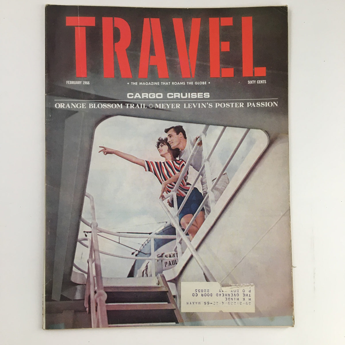 Cover of Travel Magazine February 1966 featuring a couple on a cruise pointing towards the horizon. The issue highlights the Orange Blossom Trail and Meyer Levin's Poster Passion.