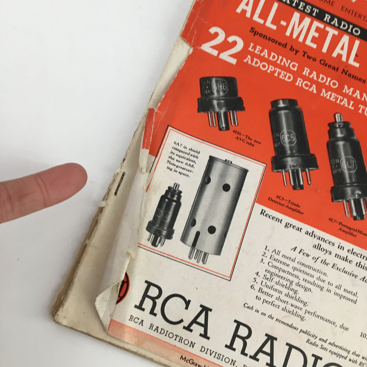 Close-up of the cover of Radio Retailing Magazine July 1935, featuring all-metal radio tubes and branded by RCA, highlighting advancements in radio technology.