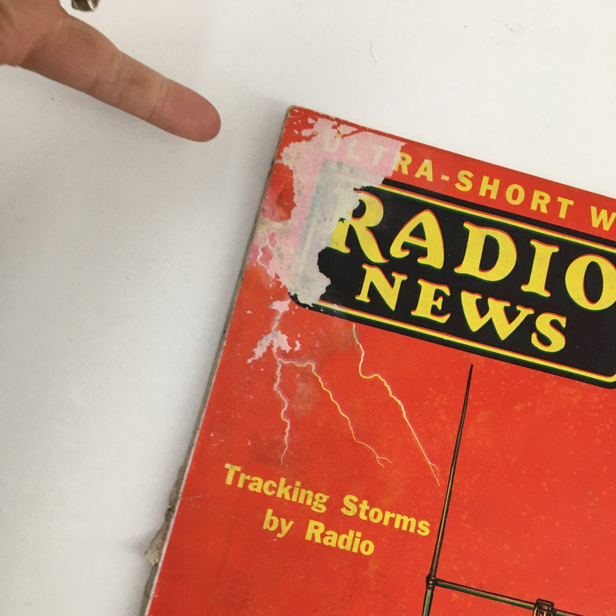 Close-up view of Radio News Magazine November 1931 cover emphasizing tracking storms and detailing the magazine's vintage features.