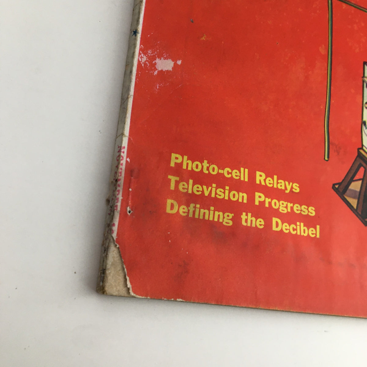 Close-up of the Radio News Magazine November 1931 cover featuring text on photo-cell relays, television progress, and defining the decibel.