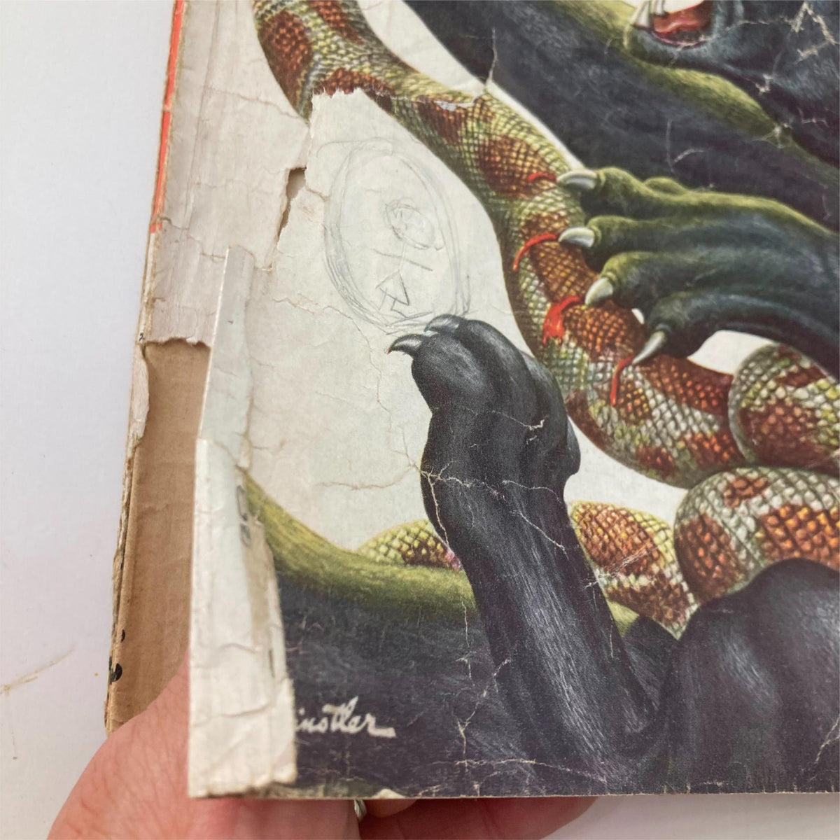 Close-up image of the cover edge of VTG Stag Magazine August 1954 highlighting wear and tear, showcasing the magazine's vintage character.