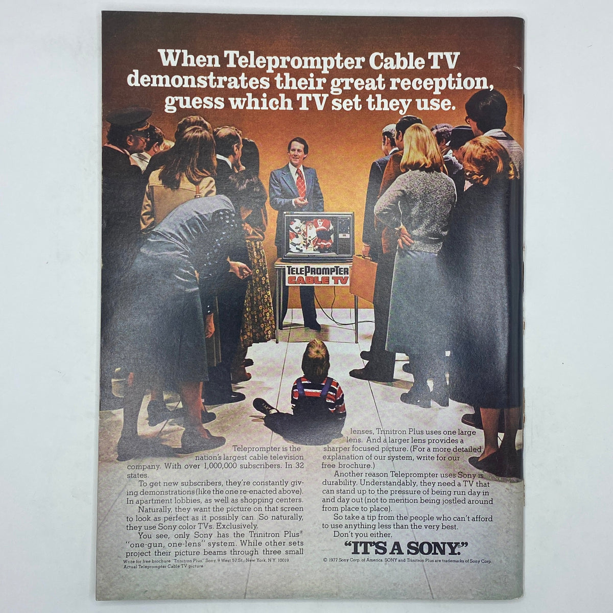 Back cover advertisement from The New Yorker, October 17, 1977, promoting Teleprompter Cable TV with a family gathered around a television set, illustrating 1970s advertising culture.