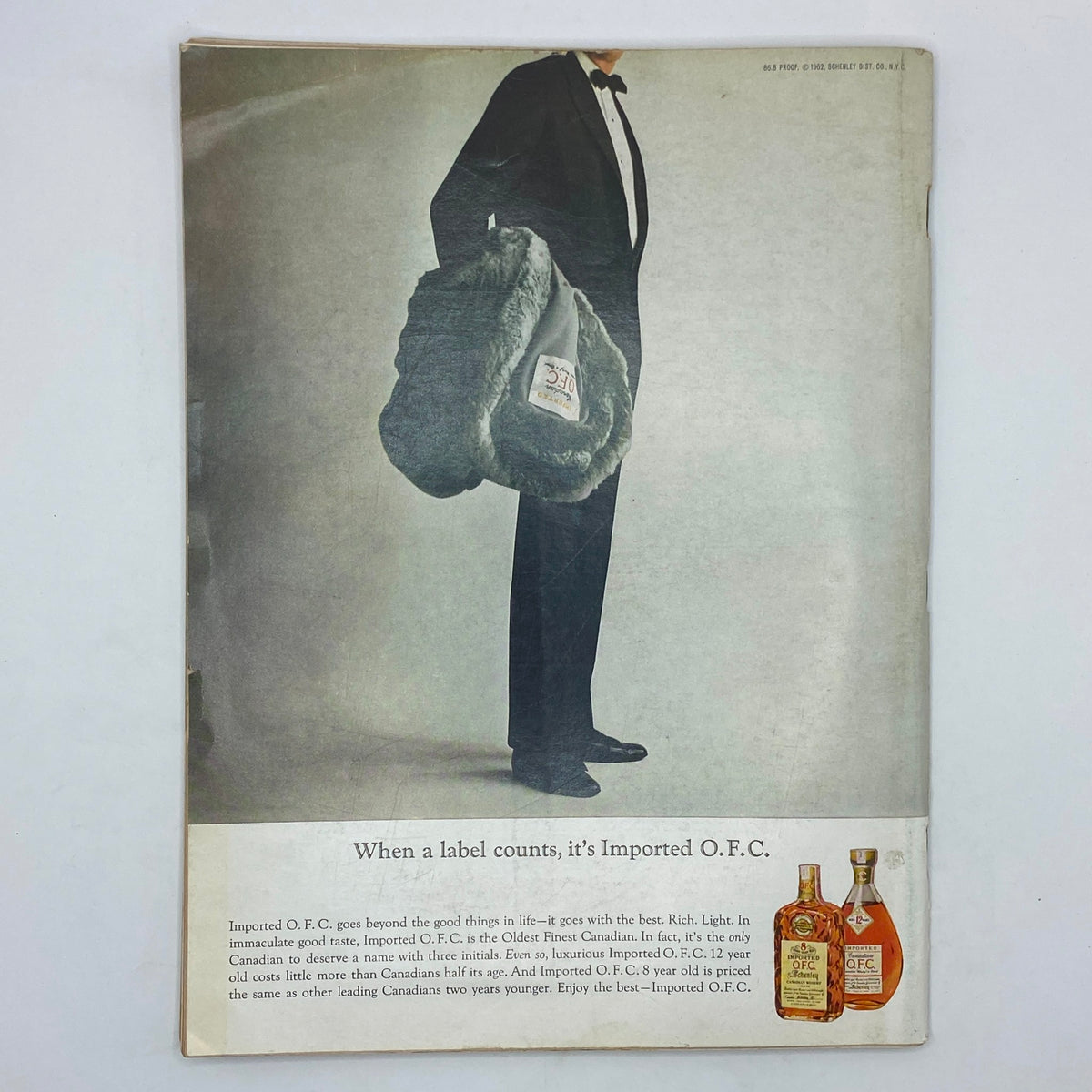 Back cover of The New Yorker Complete Magazine February 16, 1963, featuring an advertisement for Imported O.F.C. with a well-dressed man holding a fur bag.