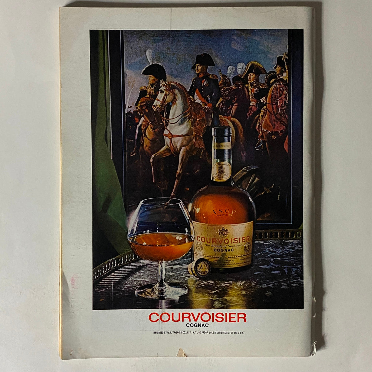 An advertisement from The New Yorker magazine September 30, 1974 featuring Courvoisier Cognac, with a glass of cognac placed on a tray alongside a painting of historical figures.