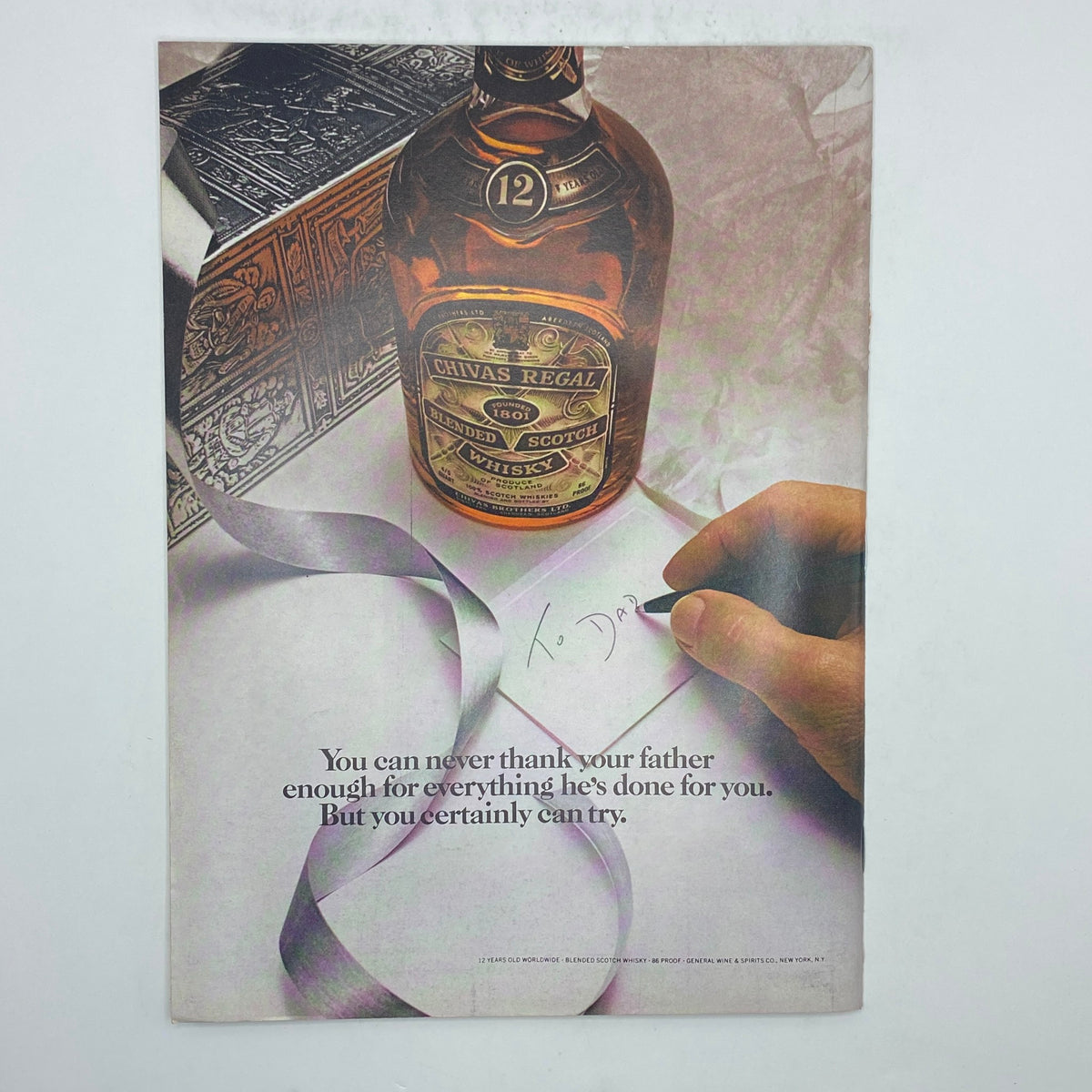 Vintage advertisement for Chivas Regal blended scotch whisky featured in The New Yorker Complete Magazine June 17, 1974. The ad depicts a bottle of scotch and a handwritten note, capturing the essence of gift-giving.