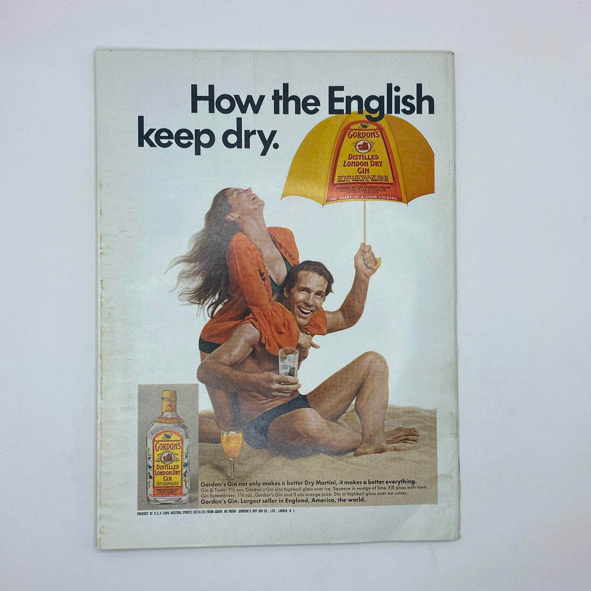Advertisement from The New Yorker Complete Magazine July 12, 1976 promoting Gordon's London Dry Gin with a cheerful couple enjoying a sunny day.