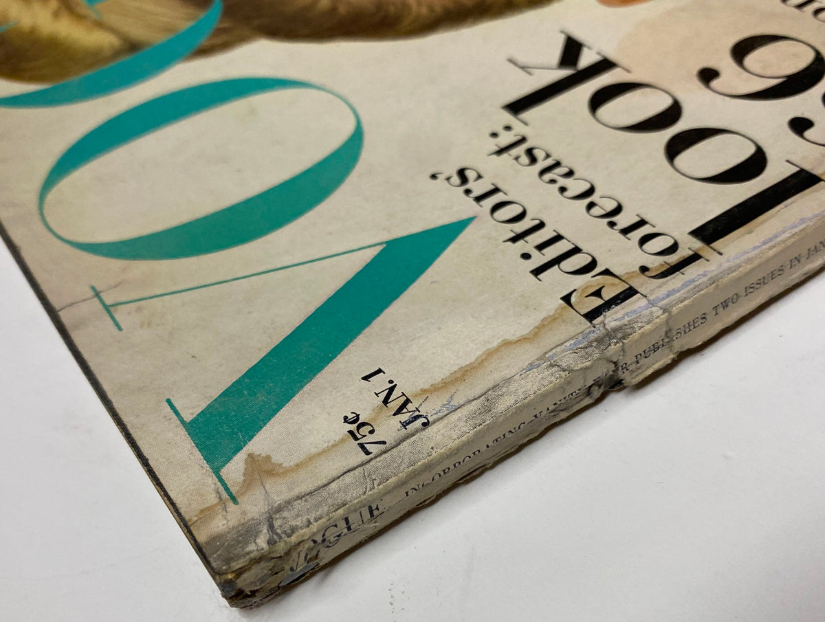 Close-up of Vogue Magazine January 1, 1966 spine showing weathered condition with details on the publication's title and the ‘Look '66’ fashion forecast.