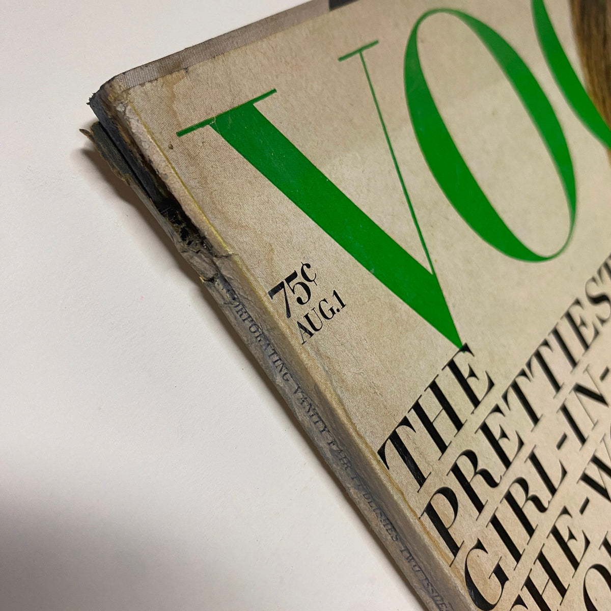 Close-up view of the top corner of the August 1, 1968 Vogue Magazine featuring the price '75¢' and date 'AUG. 1'.