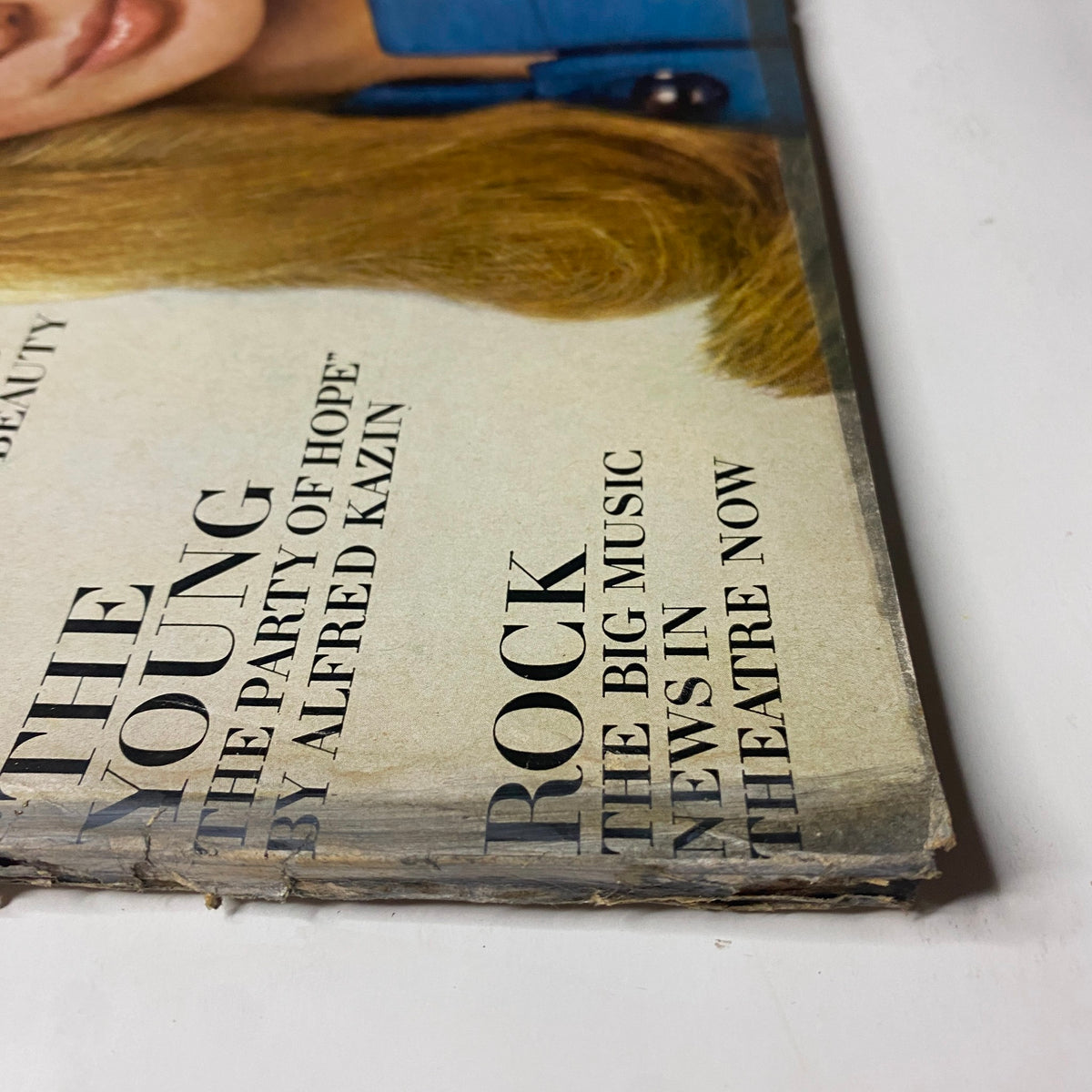 Detailed view of the side of the August 1, 1968 Vogue Magazine cover, featuring the titles 'The Young: The Party of Hope' and 'Rock: The Big Music News'.