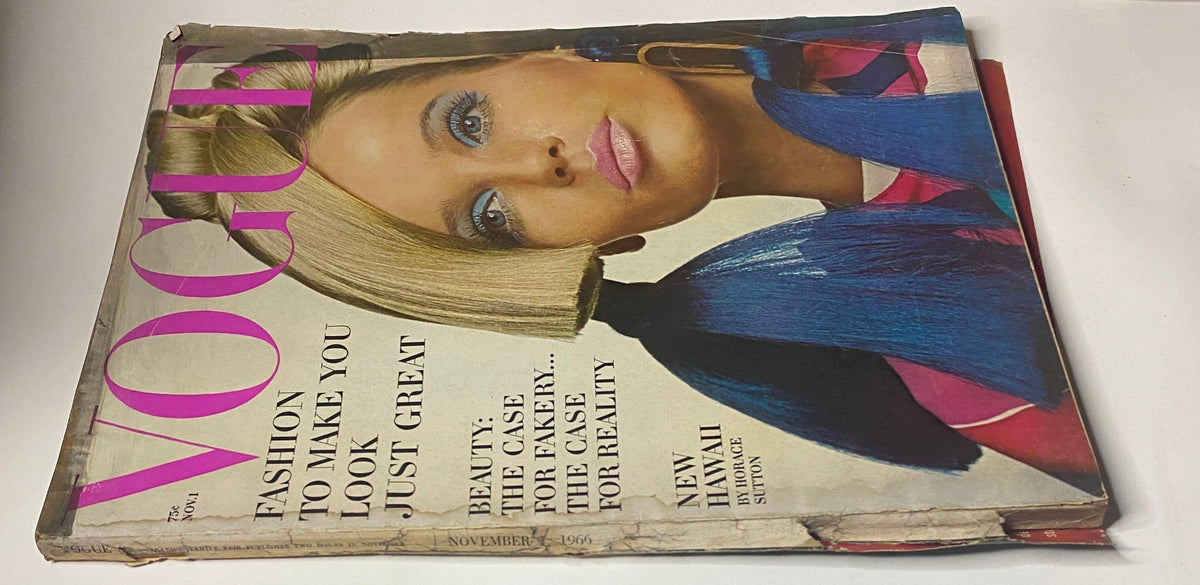 Vogue Magazine November 1, 1966 cover, showcasing Veruschka with striking blue hair accessories and makeup, indicative of mid-60s fashion styles.