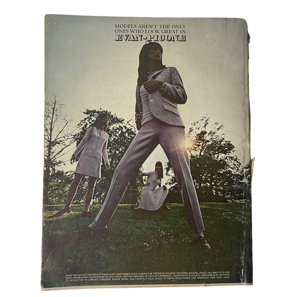 The back cover of a vintage Vogue Magazine from November 1, 1966, featuring a fashion advertisement stating 'MODELS AREN'T THE ONLY ONES WHO LOOK GREAT IN YVES SAINT LAURENT'. The magazine highlights fashion and style from a significant era in fashion history.