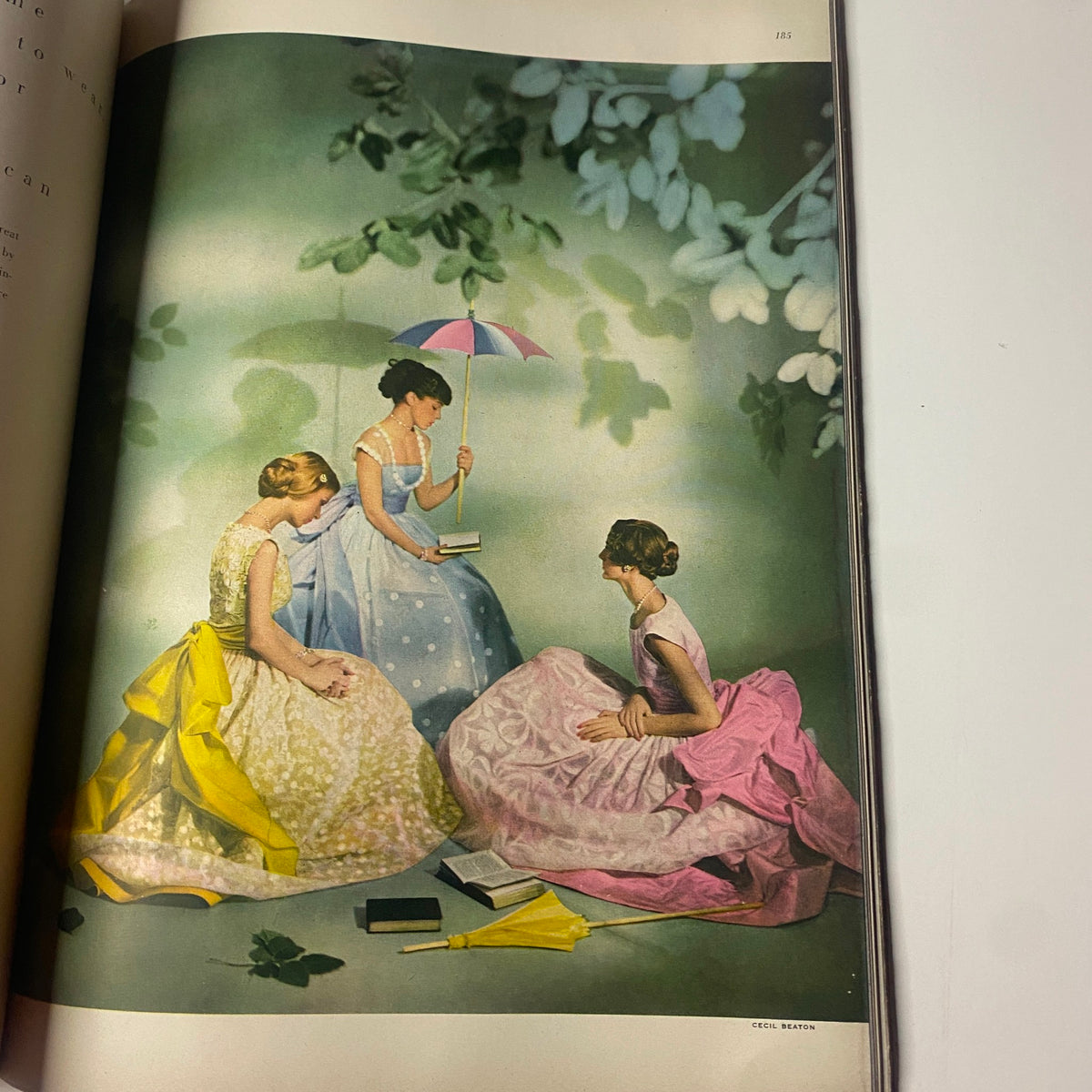 Colorful fashion photograph from Vogue Magazine February 1, 1948 Americana Number 1948, depicting three women in elegant dresses with an artistic background.