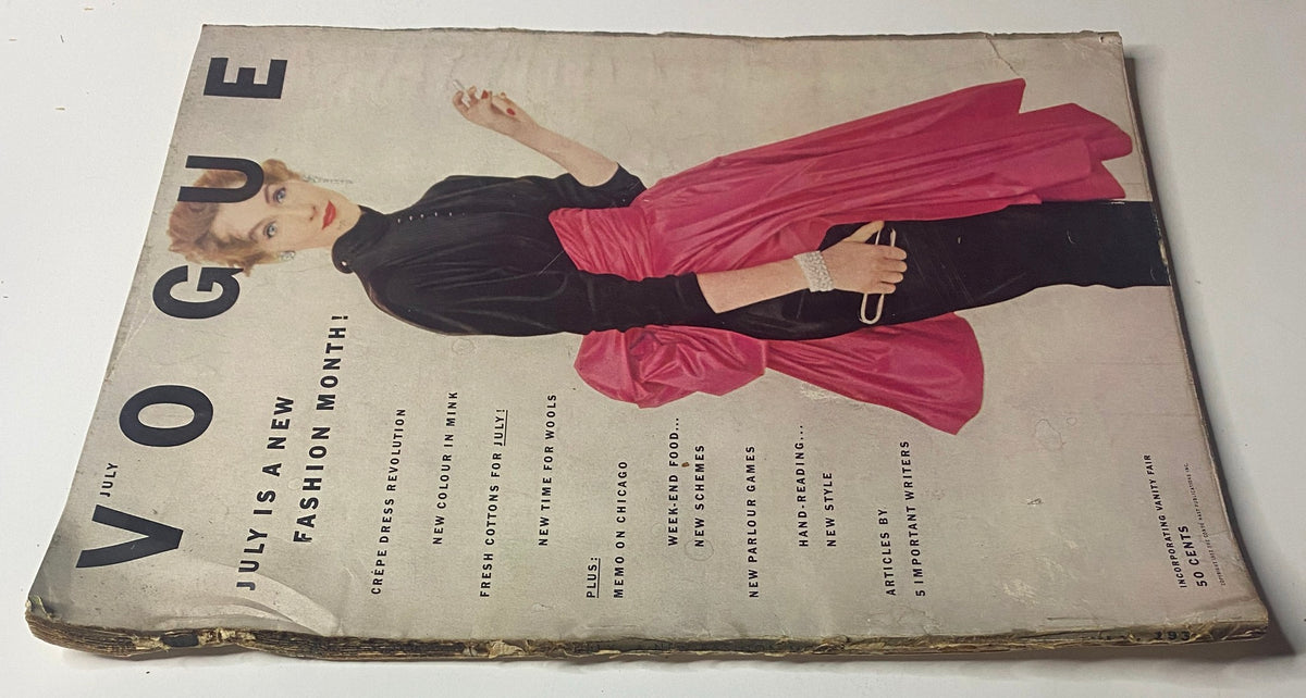 Vogue Magazine July 1952 cover showcasing a model wearing a stylish black top and a pink skirt, emphasizing the summer fashion trends and captured by photographer Irving Penn.