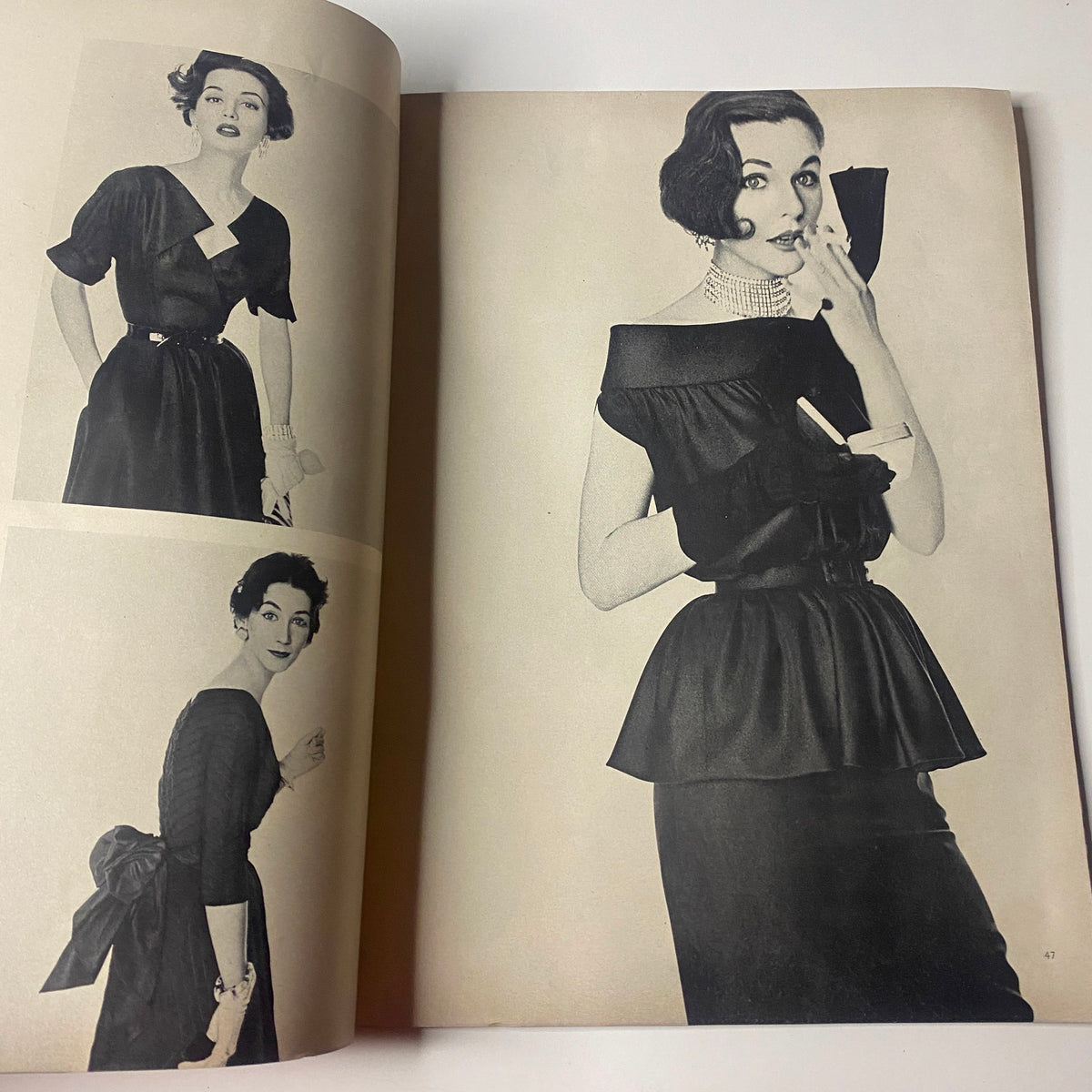 Fashion editorial spread from Vogue Magazine July 1952 showing three models in elegant outfits. Vintage photography captures styles from the issue featuring Ruth Neumann cover by Irving Penn.