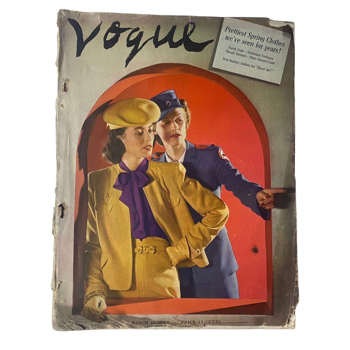 Cover of Vogue Magazine from March 15, 1943 featuring a model in a yellow suit with a purple blouse and a hat, alongside a uniformed woman. The title highlights 'Prettiest Spring Clothes We’ve Seen for Years.' An original magazine from the 1940s, showcasing mid-century fashion.