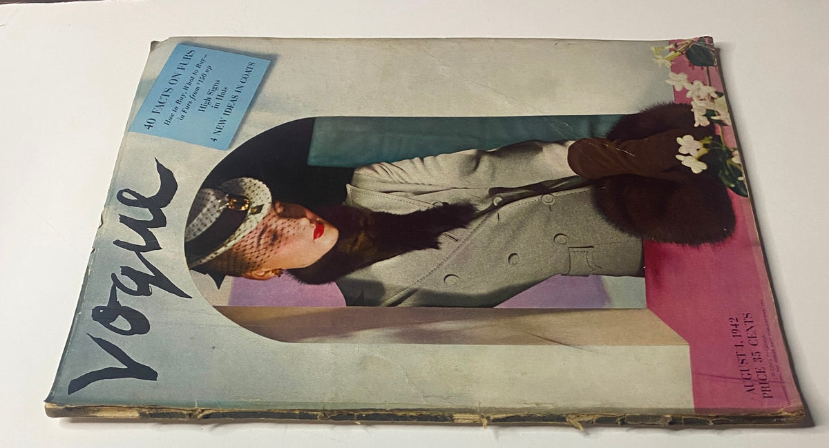 Side view of Vogue Magazine August 1, 1942 featuring Lenore Simon on the cover, showcasing a gray coat with fur detailing. Price listed as 35 cents, highlighting vintage magazine design.