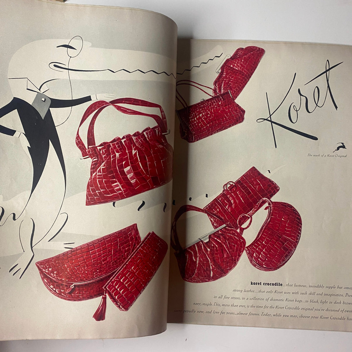 Ad showcasing red croc bags from Koret in Vogue Magazine August 1, 1942, featuring a stylish illustration of the accessories.