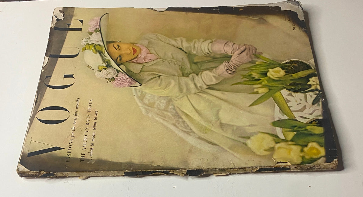 Vogue Magazine April 15, 1948 Dorothy Griffith by John Rawlings cover image showcasing a model wearing a large hat with flowers, embodying the fashion and elegance of postwar era.