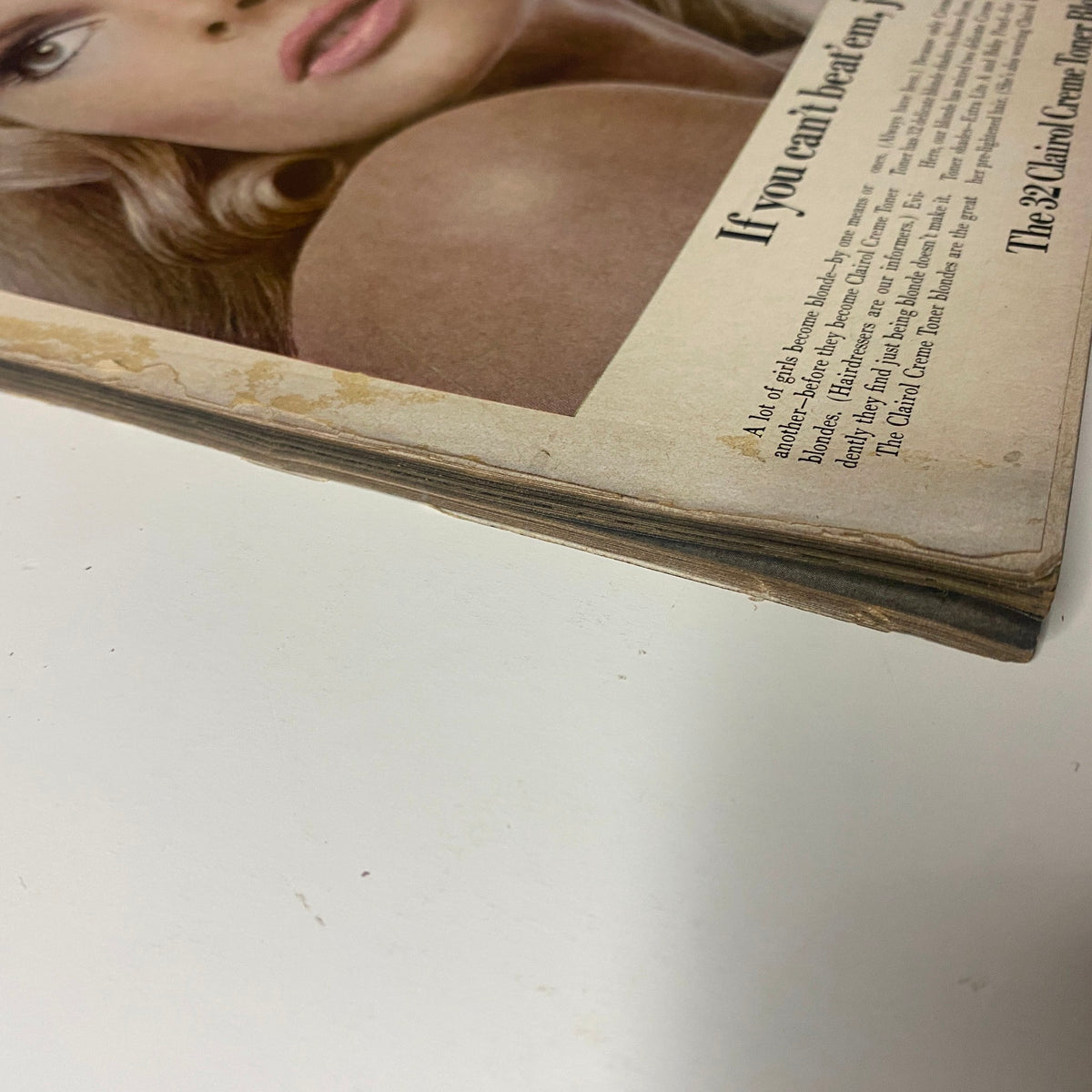 Vogue Magazine February 15, 1968 Jean Shrimpton Cover by Irving Penn, close-up of magazine page showing wear and aging, emphasizing its vintage quality.