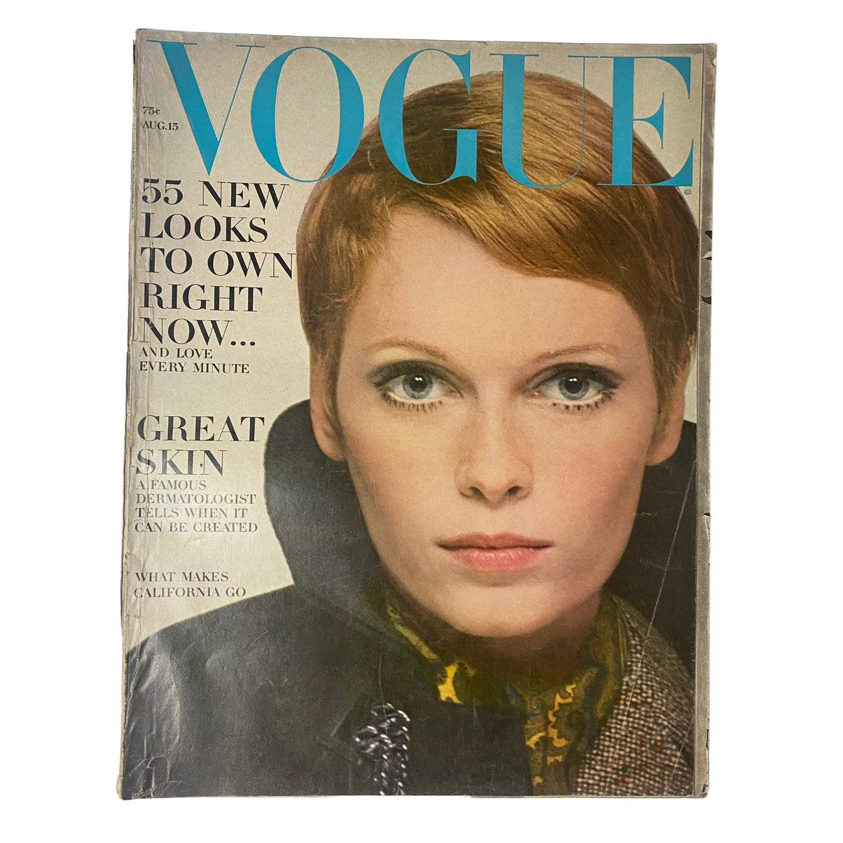 Vogue Magazine August 15, 1967 featuring Mia Farrow on the cover. The magazine showcases a striking close-up portrait of Farrow, highlighting her fashion-forward look and vibrant makeup, epitomizing the style of the late 1960s.