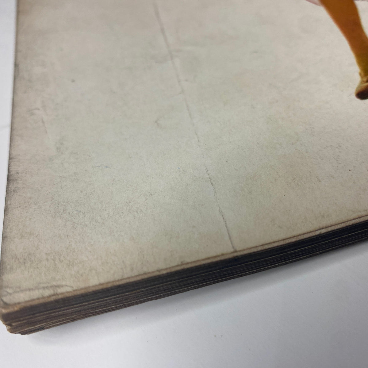Close-up of the spine of Vogue Magazine February 1, 1969, showing vintage wear and light water damage, reflective of its history and decades of storage.