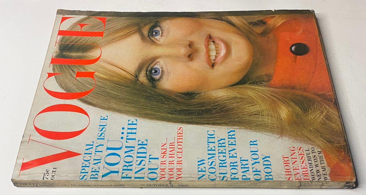 Another view of Vogue Magazine October 1, 1969 Jean Shrimpton Cover by Bert Stern, highlighting the same iconic model with a focus on her expressive blue eyes and the vibrant orange coat, exemplifying 1960s fashion.