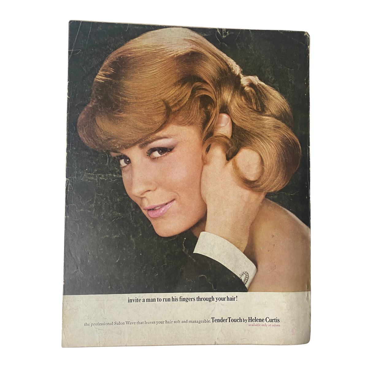 The back cover of Vogue Magazine October 1, 1964 showcasing a model with stylish hair, promoting haircare products, encapsulating the beauty trends of the mid-1960s.