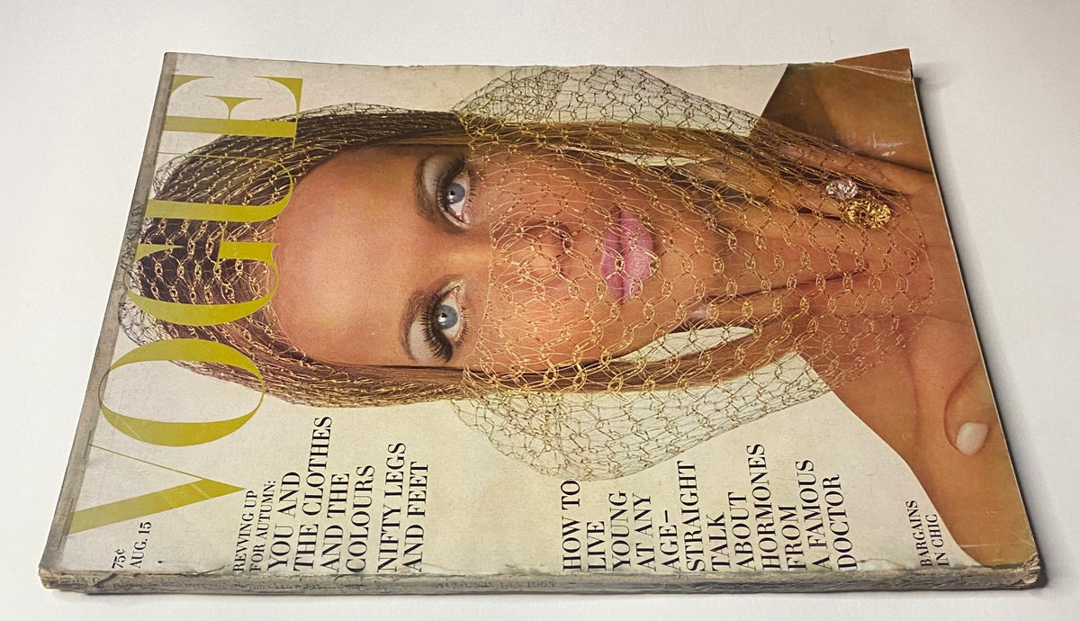 Vogue Magazine August 15, 1965 cover displaying Veruschka, captured by Irving Penn, emphasizing vintage fashion and photography from the 1960s.
