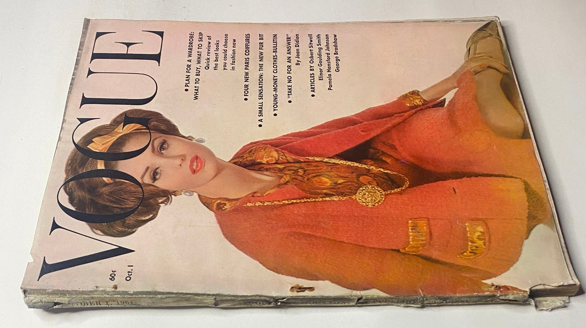 Back view of Vogue Magazine October 1, 1961 featuring Dorothy McGowan. The magazine highlights transitional autumn fashion and advertising themes from the era.