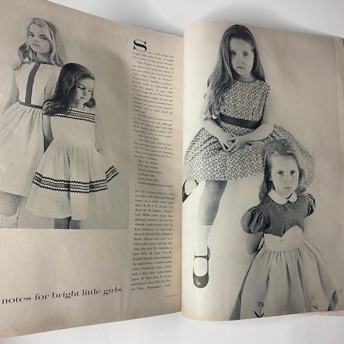 Vogue Magazine April 15, 1961 featuring a fashion spread titled 'Notes for Bright Little Girls' showcasing children in stylish dresses, exemplifying early 1960s fashion trends.