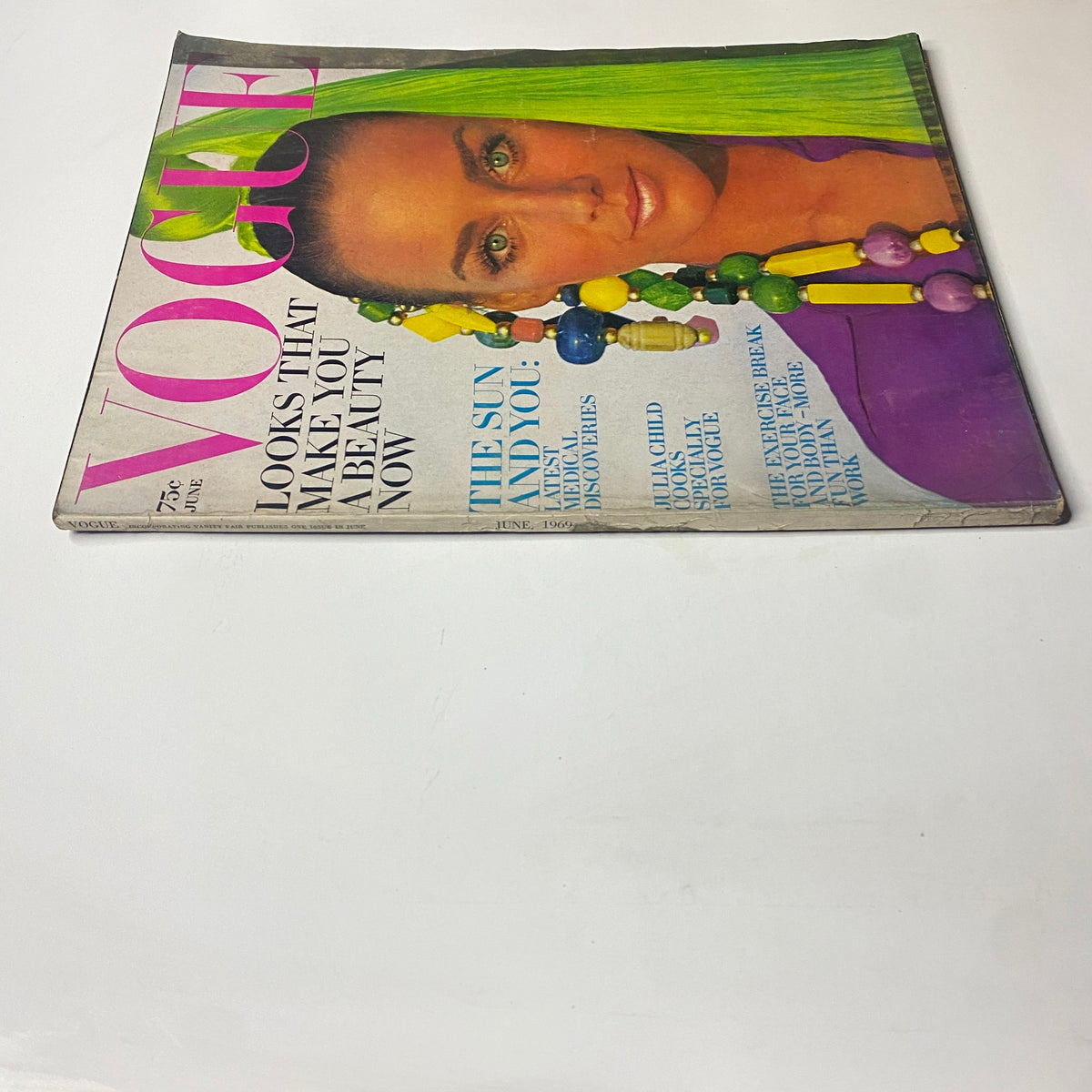 Side view of Vogue Magazine June 1969, featuring the cover image of Windsor Elliott and the title, showcasing bold colors and design typical of vintage fashion magazines.