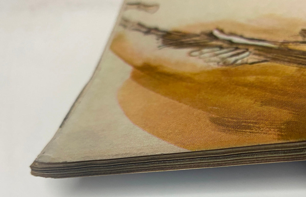 Close-up of the spine from Vogue Magazine July 1961 featuring Deborah Dixon cover by Bert Stern, illustrating the vintage wear and tear typical of mid-century magazines.