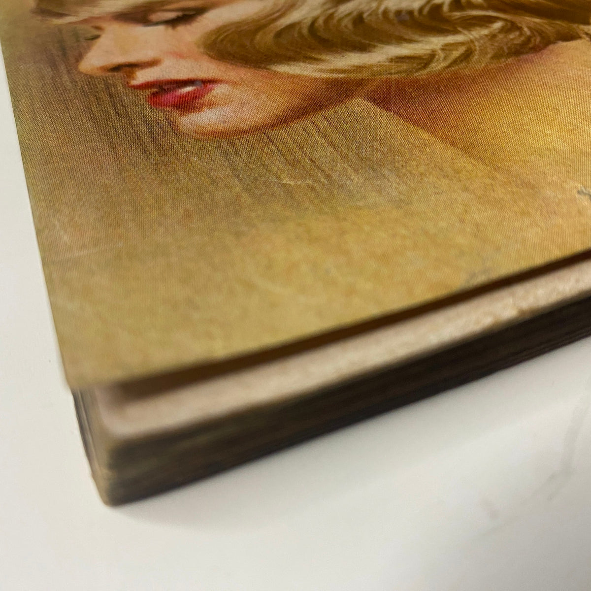 Close-up view of the spine and cover of Vogue Magazine May 1969 featuring Windsor Elliott, showcasing vintage details and wear indicative of its age.