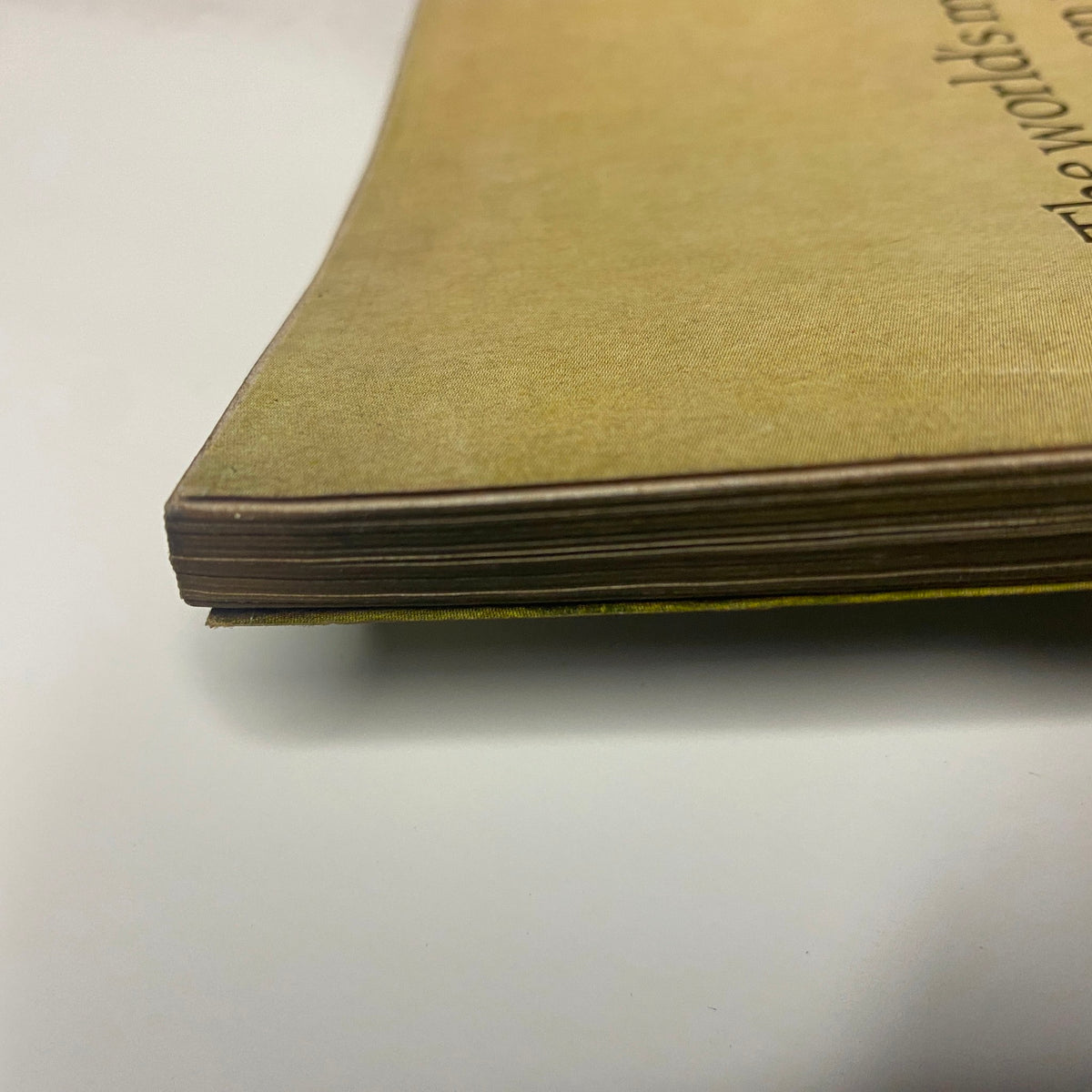 Side view of the spine of Vogue Magazine May 1969, highlighting the vintage paper aging and aesthetic appeal of the publication.