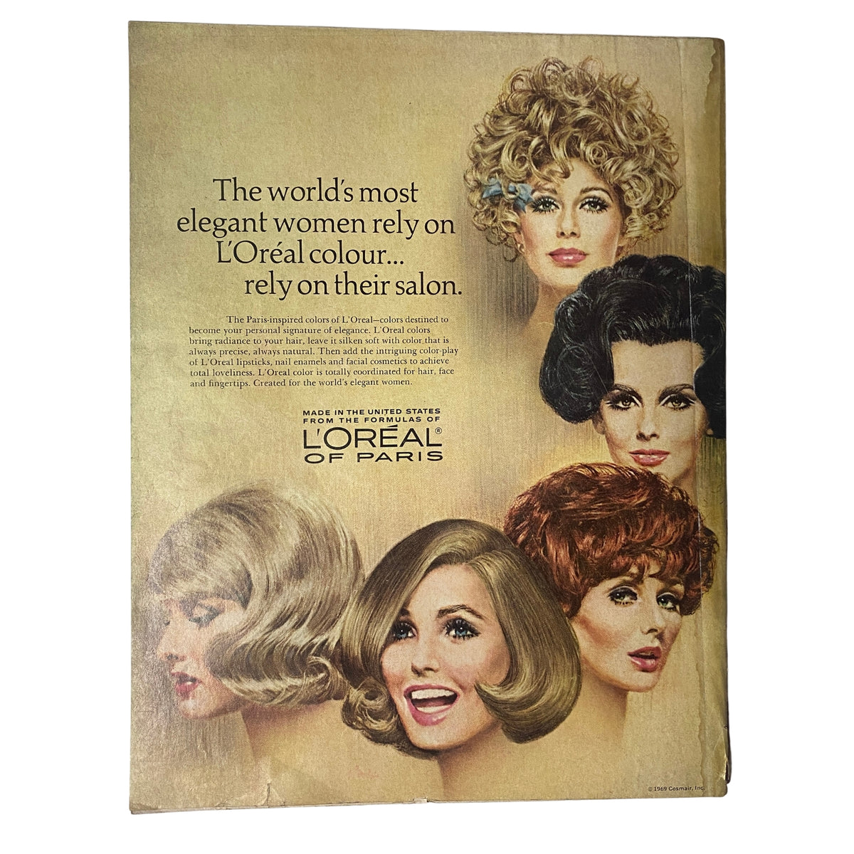 Back cover of Vogue Magazine May 1969, featuring a vintage advertisement for L'Oréal, displaying iconic hairstyles from the era.