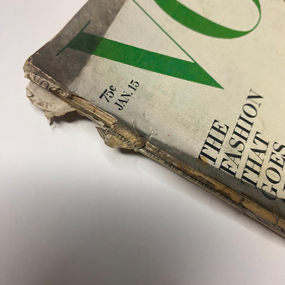 Detail of the January 15, 1965 Vogue Magazine featuring the corner of the cover with text indicating the date and price, showcasing its vintage appeal and condition.