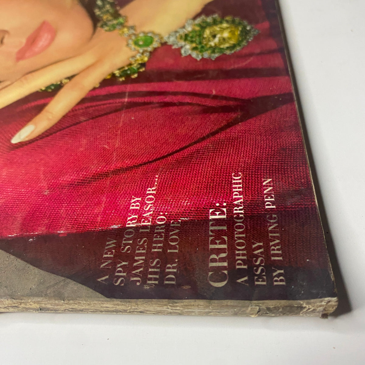 Close-up of the January 15, 1965 Vogue Magazine cover highlighting a fascinating article about Crete, alongside a prominent photographic essay by Irving Penn.