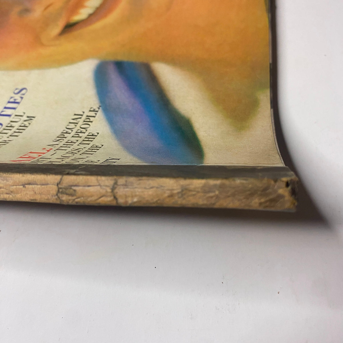 Close-up of the spine of Vogue Magazine July 1969, showcasing the magazine's title and vintage wear, featuring Susanne Schöneborn on the cover by John Cowan.
