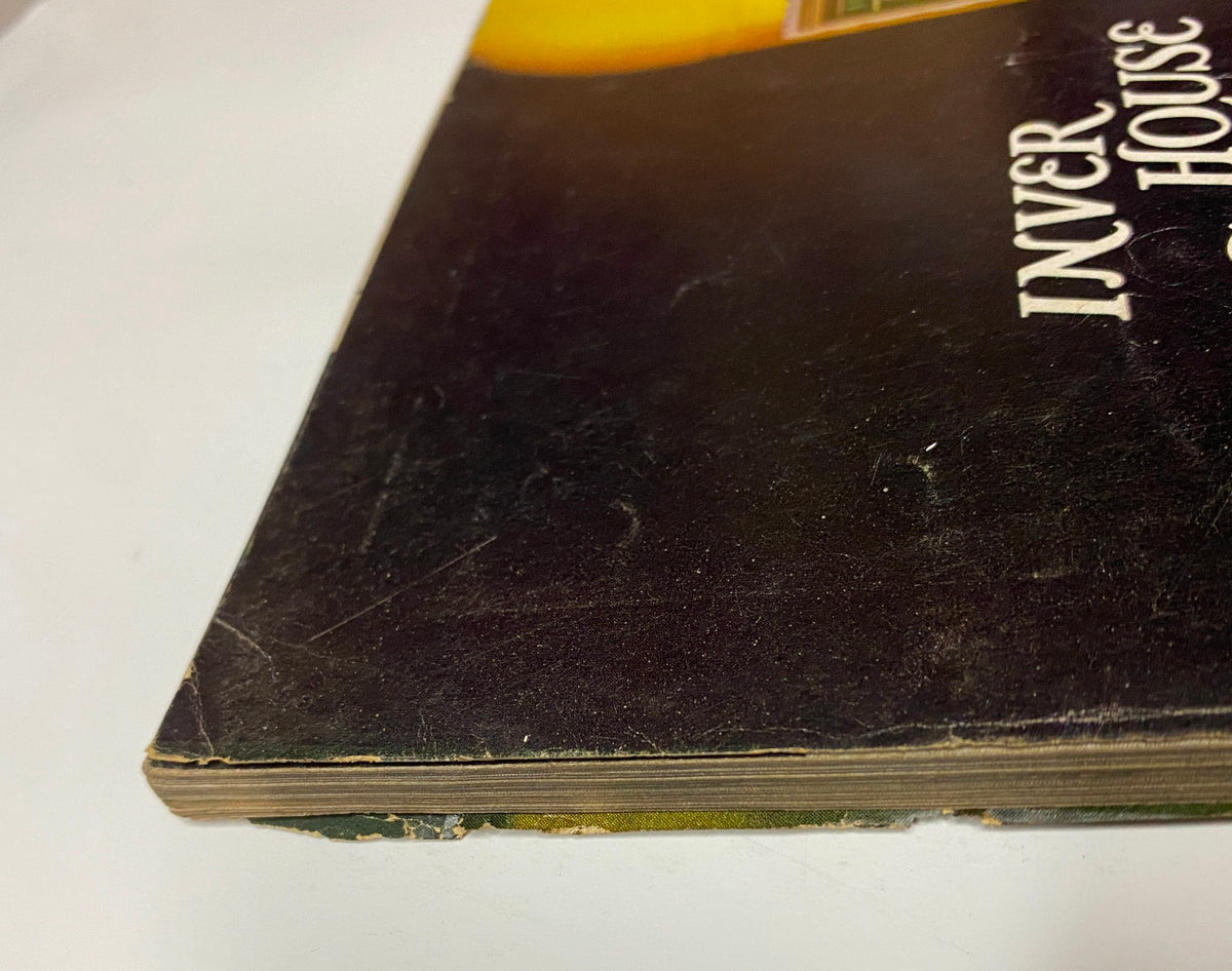 Side view of the spine of Vogue Magazine July 1968 featuring Lauren Hutton cover by Irving Penn, highlighting vintage wear including edges and spine condition.