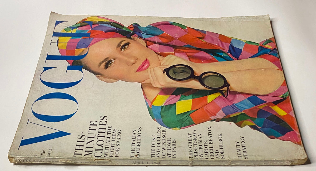 Close-up view of Vogue Magazine from April 1, 1964, showcasing model Brigitte Bauer in a vibrant patterned outfit and sunglasses, capturing the essence of early 1960s fashion.