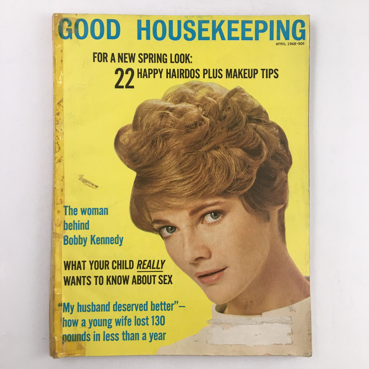 Good Housekeeping Magazine April 1968 cover featuring the title 'The Woman Behind Bobby Kennedy' with a vibrant yellow background and a model showcasing a hairstyle.