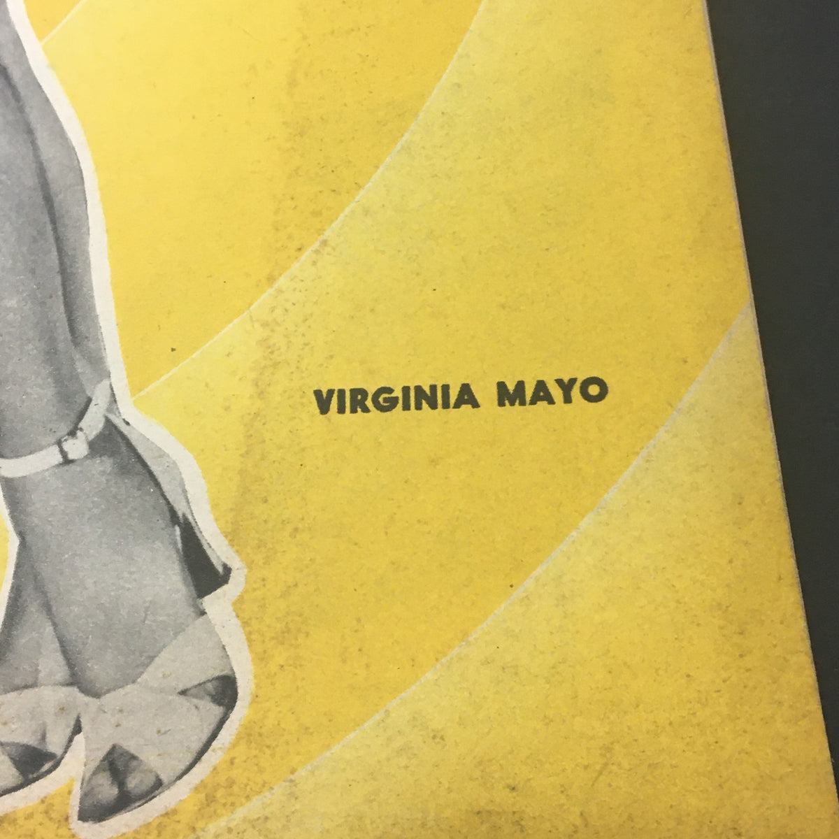 Close-up of the name 'Virginia Mayo' on the May 1949 cover of VTG Picture Show for Men Magazine, illustrating its classic design and featuring the era's elegant style.