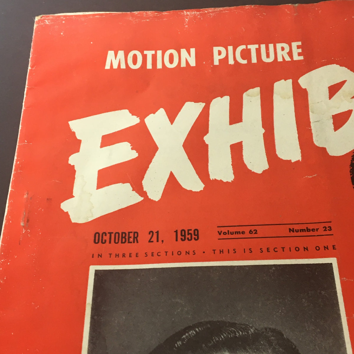Close-up of the Vintage Motion Picture Exhibitor magazine cover from October 21, 1959, Volume 62, Issue #23, emphasizing the publication date, volume, and section details, along with the prominent title 'EXHIBITOR.'