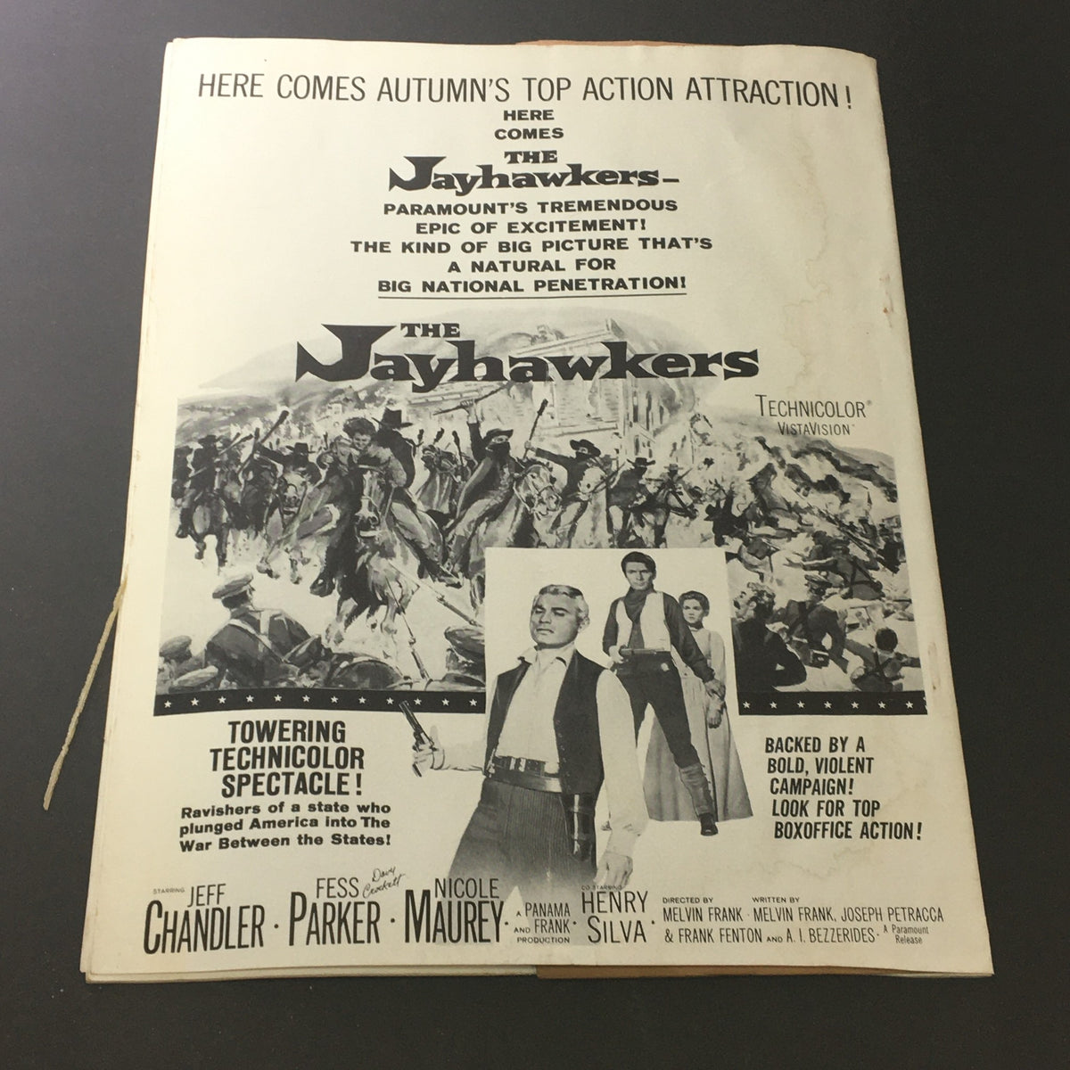 Cover page of VTG Motion Picture Exhibitor featuring promotional imagery for the film The Jayhawkers, highlighting its action-packed storyline and Technicolor presentation.